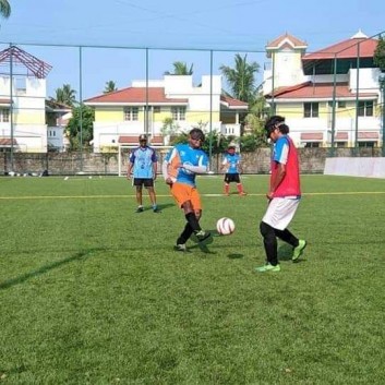 Blind footballer Anthony Samuel kicking the ball towards an opponent in a training activity