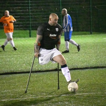 Mark Smith, amputee football player with the ball in a match
